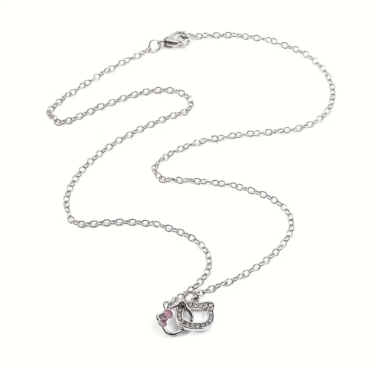 Hello Kitty Outline Pendant Necklace – Dainty Silver with Pink Bow Accent