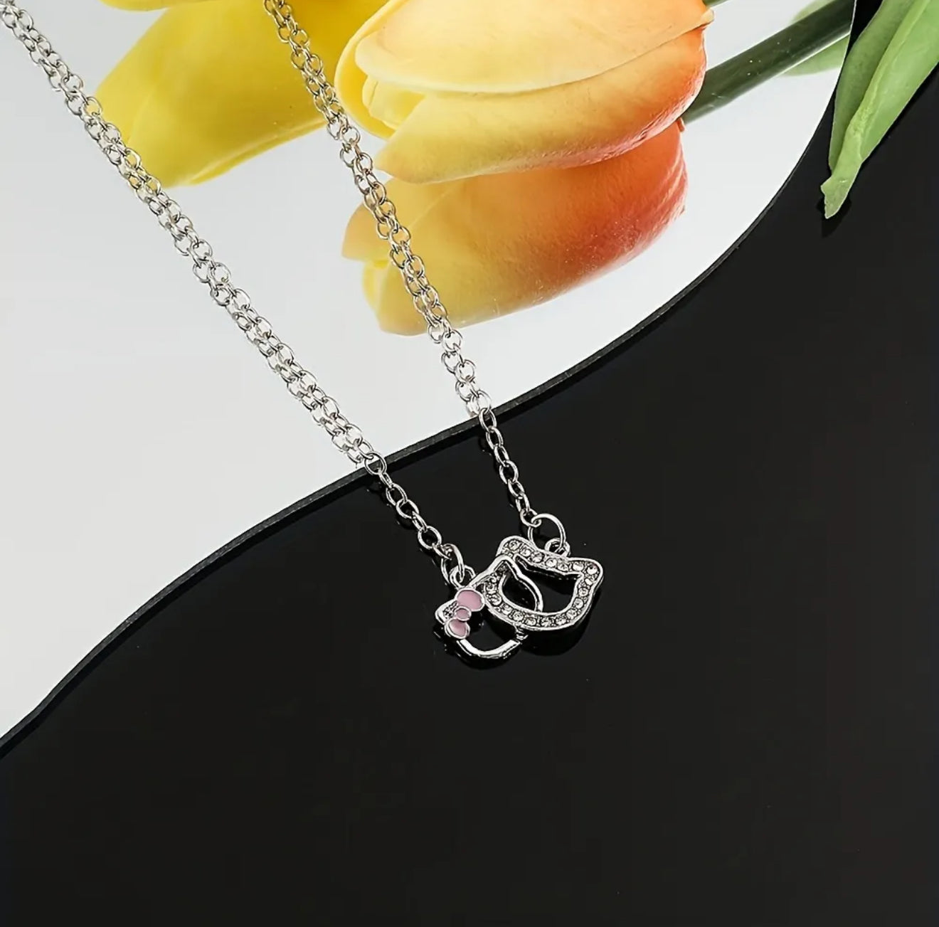 Hello Kitty Outline Pendant Necklace – Dainty Silver with Pink Bow Accent